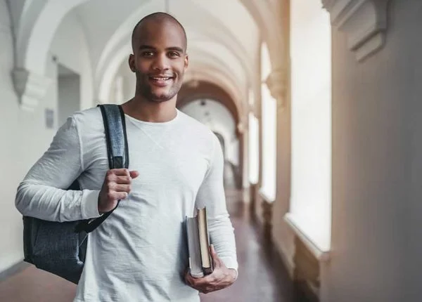 What is a BSc in Business Management? male student smiling